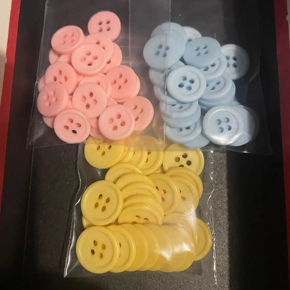 Vintage lot plastic four hole pastel pink blue yellow clothing flat buttons